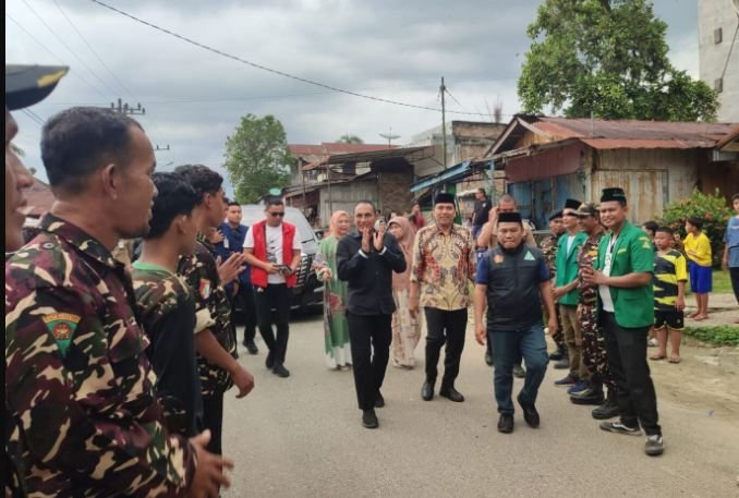 Kampanye di Labusel, Edy-Hasan Disambut Banser dan Putri Bupati
